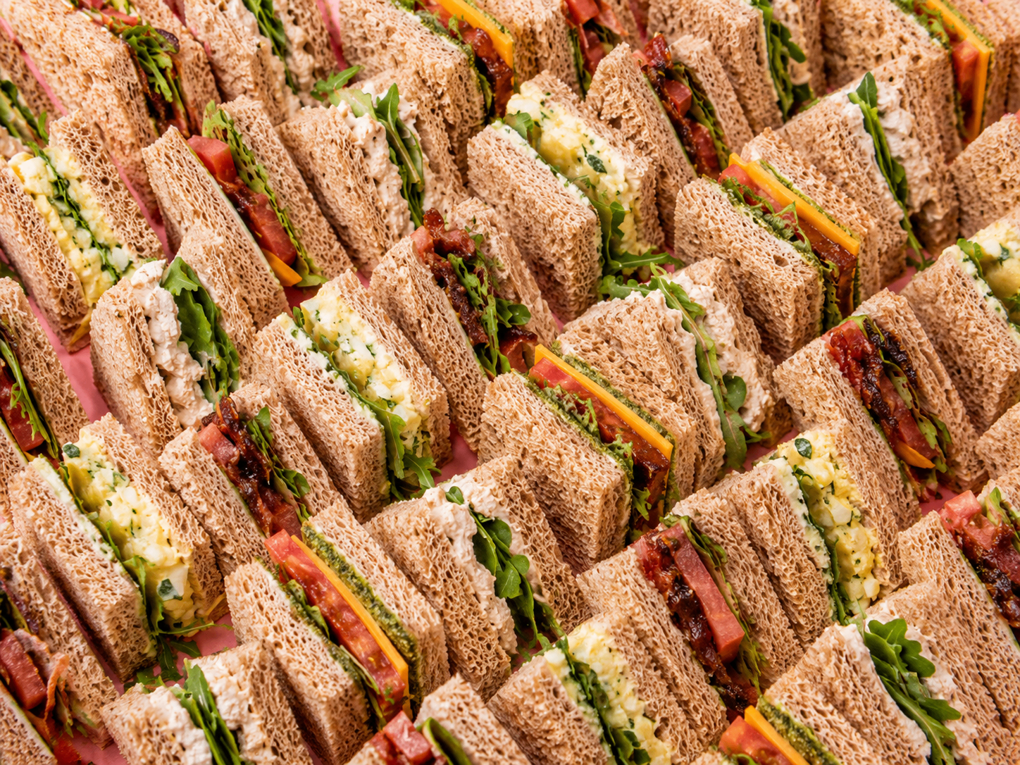 Assorted finger sandwiches — egg mayo, chicken mayo and bacon tomato