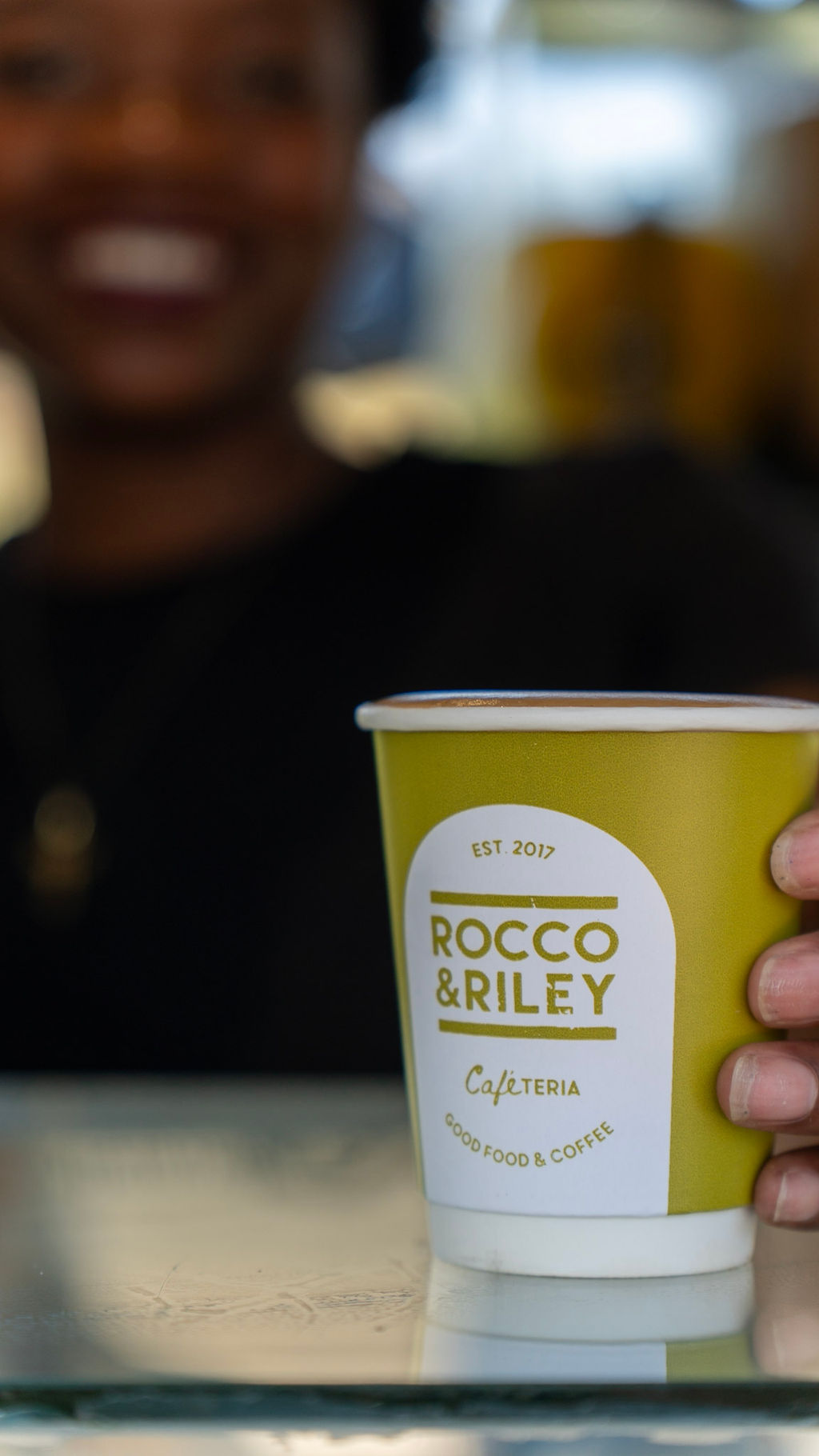 Rocco & Riley branded coffee cup closeup